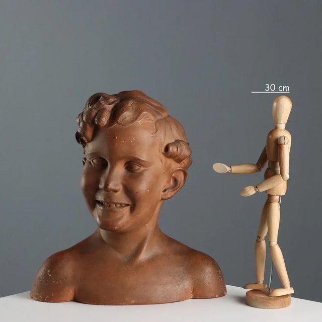 Terracotta bust of a boy. Signature engraved on the back 'A. Menchi'. This piece is attributed to the mentioned...