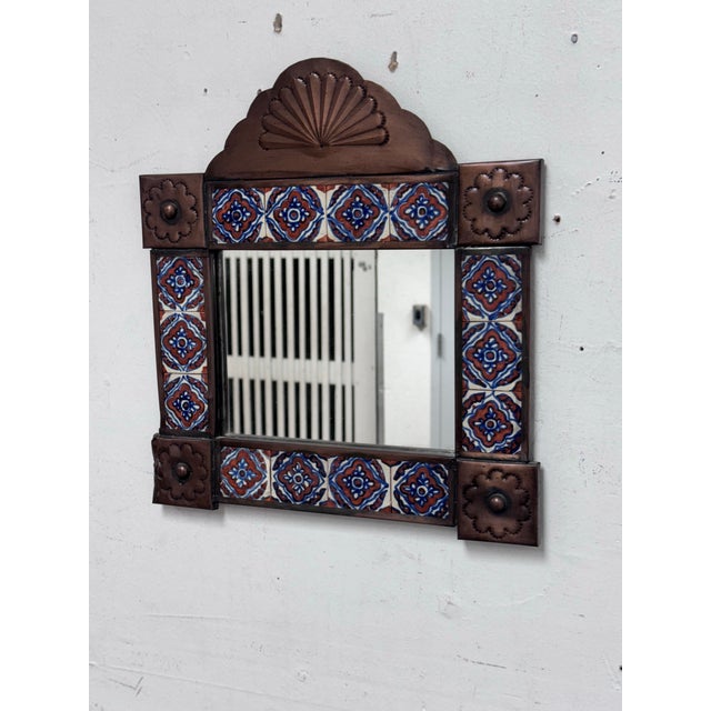 Design Plus Gallery presents a Handcrafted Wall Mirror with Mexican Folk Art Style. The frame is embossed with tin that...