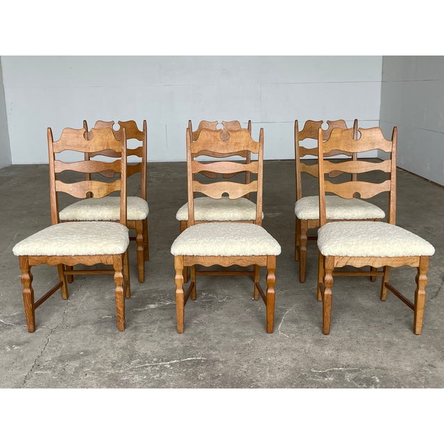 A sculptural and highly recognizable set of six high-back “Razorblade” dining chairs designed by Henning (Henry) Kjærnulf...