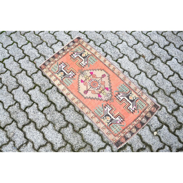 This is a vintage Turkish Oushak rug from the 1960s. The piece was hand-knotted.