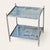 Mid-20th-century chrome-plated side table in the style of Maison Jansen, featuring elegant turned legs, spherical finials,...