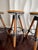 Set of 4 Industrial Tripod Legs Cb2 Acacia Wood Round Seat Adjustable Counter Stools With Wrought Metal Hardware For Sale - Image 9 of 12