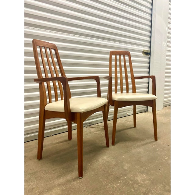 Teak chairs made in Sweden by Svegards Markaryd .Set of two Captain Chairs in good condition with leather upholstery .