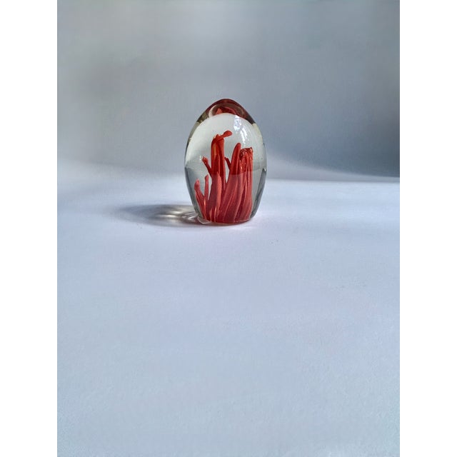 Italian Fulvio Bianconi Murano attributed clear egg-shaped Art Glass Paperweight. Featuring a transparent solid ovoid...
