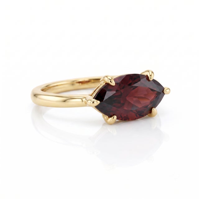 Add a bold touch of timeless romance to your jewelry collection with this stunning horizontal marquise ring. Featuring a...