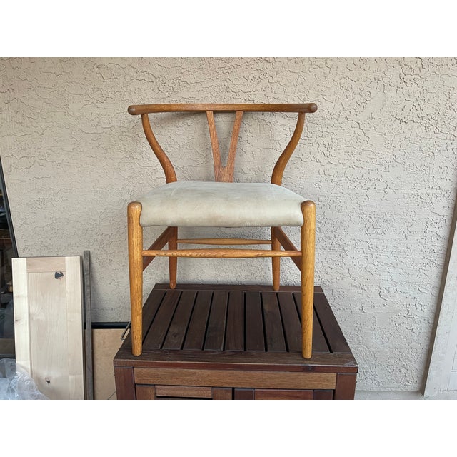 The Wishbone Chair, also known as the CH24 or Y-chair, is an iconic piece of Danish modern design Attributed to Hans J....