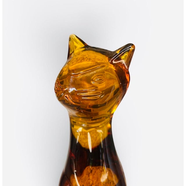 Amber mold blown glass cat by Viking glass released in 1964 as part of the Epic line. The original price in 1964 was $5....