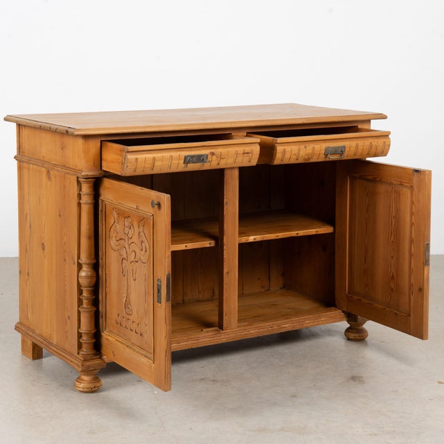 19th century Danish sideboard, crafted in pine with two upper drawers positioned above two decorative paneled cabinet...