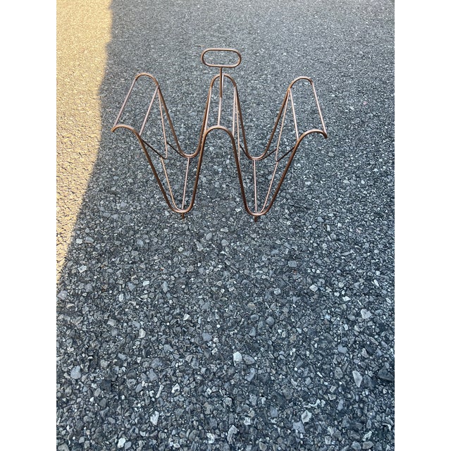 Mid Century Modern Magazine Rack in a Geometric Design and Copper Color .
