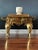 Handsome English brass footman designed for the fireside. The rectangular top sits above a shaped apron with diamond and...