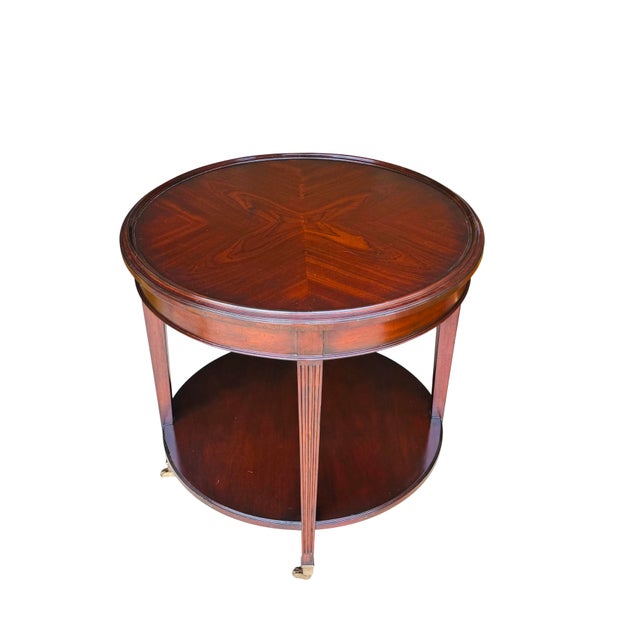 Vintage Mahogany Two-Tier Side Table | Bookmatched Starburst Top | Fluted Legs | Brass Caster Feet For Sale - Image 6 of 11
