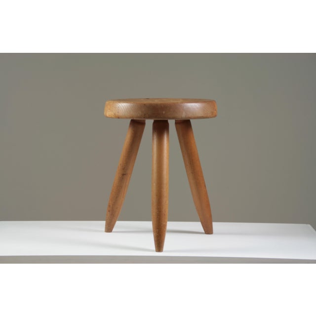 An icon of 20th-century design, the Berger high stool, designed by Charlotte Perriand, embodies raw and functional...
