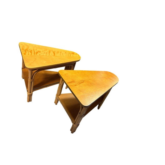 This beautifully restored pair of restored rattan 2-tiered stacked rattan wedge tables, each featuring 2 levels blending...