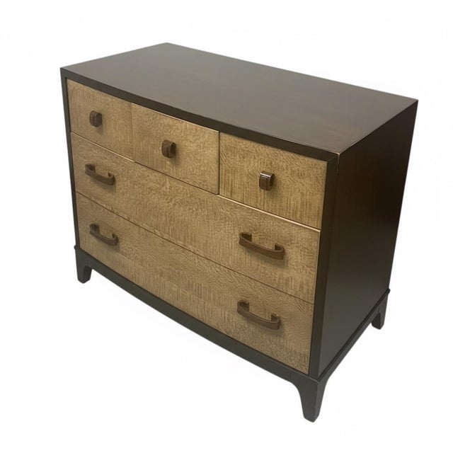 A sophisticated pair of modern bachelor chests featuring a striking two-tone design. The dark mahogany-stained frames...