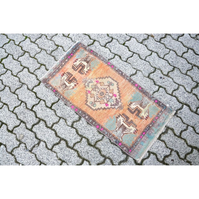 This is a vintage Turkish Oushak rug from the 1960s. The piece was hand-knotted