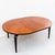 Restored one-of-one vintage walnut dining table with ebonized mahogany base and brass racetrack inlay, original to an...