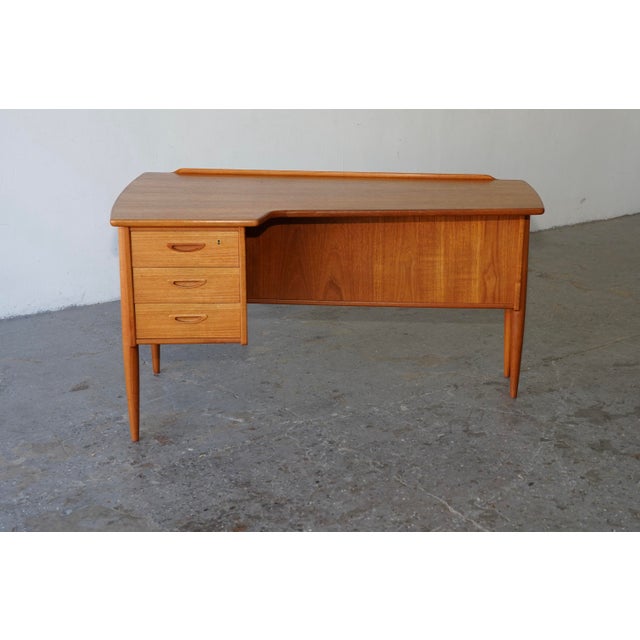 A stunning example of Teak Swedish / Danish Mid-Century Modern design, this Model A10 desk was masterfully crafted by...