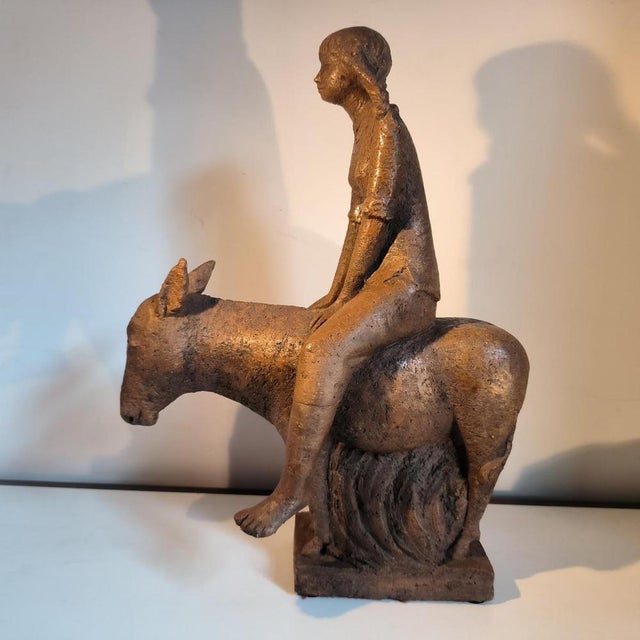 Belgian school, probably liège region — young woman with a donkey, partially glazed terracotta group, monogrammed "jc", ca...
