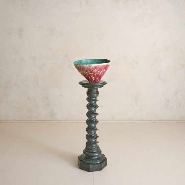An Italian pedestal from the late 19th century, carved from richly veined green marble with deep moss tones and lighter...