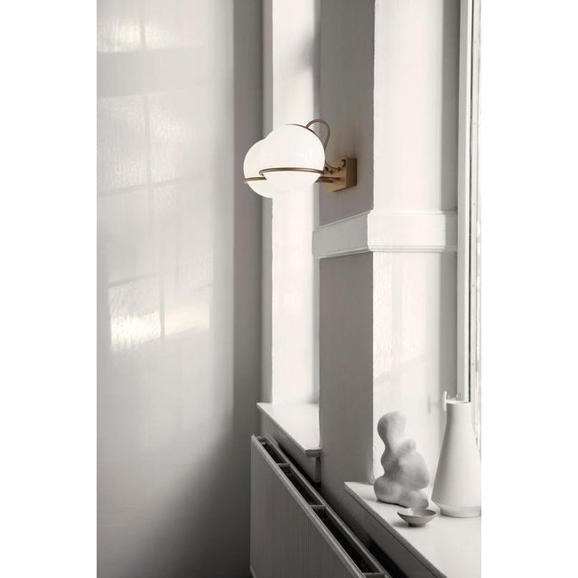 Model 238/2 design by gino sarfatti the two blown opaline glass spheres are gently held in place by two black, or...