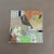 An original mixed-media collage that brings together fragments of vintage book pages, music notation, graph paper, painted...