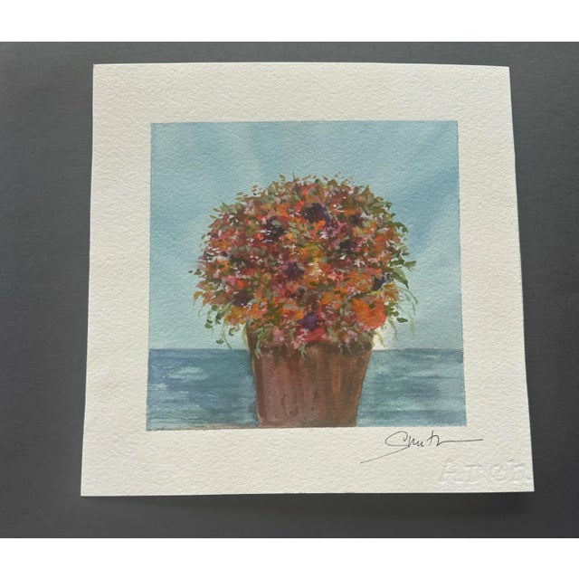 Flowers packed into a planter in a dense display of color.