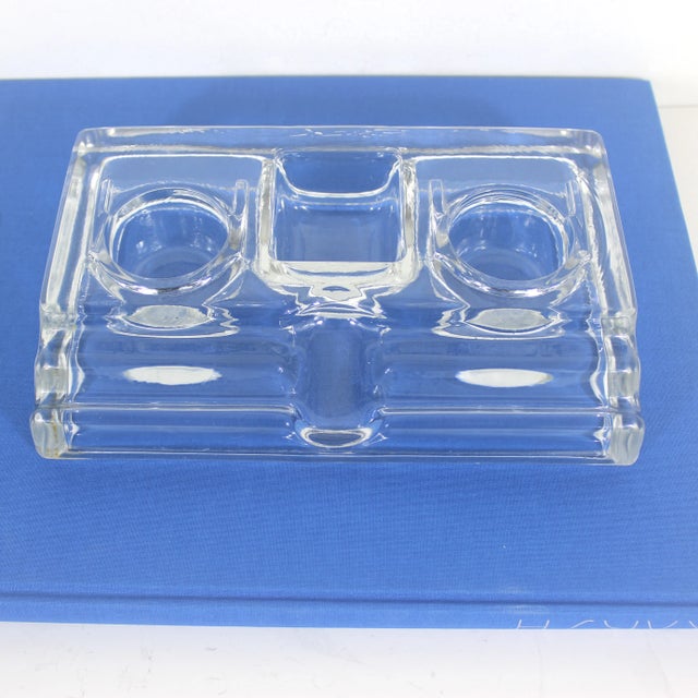 Vintage clear glass inkwell and pen holder or tray. This has two round bowls and on square bowl at the back with two pen...