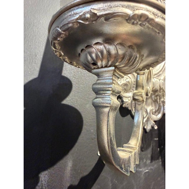 Pair of 19th century Caldwell silver plated baroque style sconces with cherubs design, 2 lights