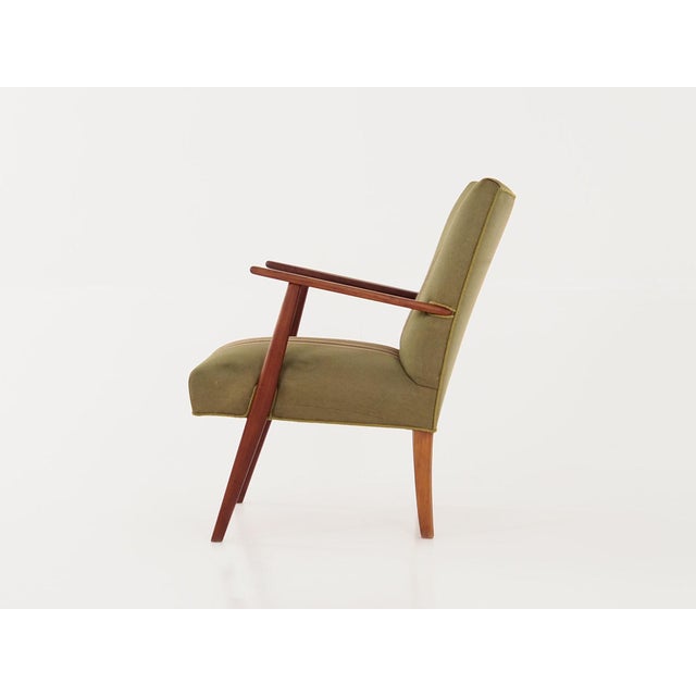 The armchair was made in the 1960s, Danish production. The structure and legs are made of solid teak. The armchair is...