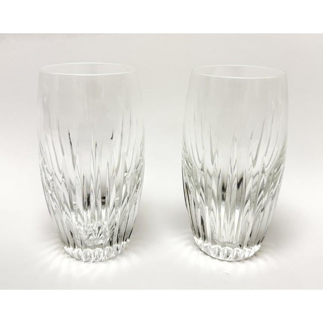 This pair of Baccarat Massena highball glasses showcases beautifully blown crystal with crisp vertical cuts that taper...