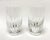 This pair of Baccarat Massena highball glasses showcases beautifully blown crystal with crisp vertical cuts that taper...
