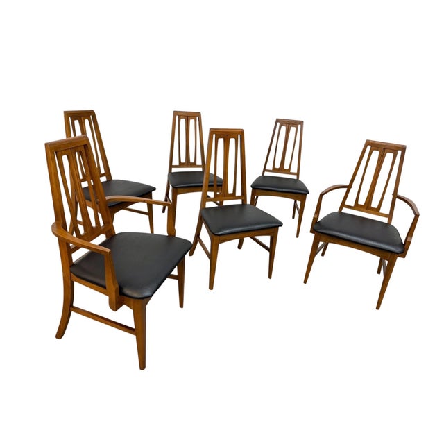 An elegant set of six Mid-Century Modern dining chairs by Young Manufacturing Co., circa 1960s. Crafted in richly grained...