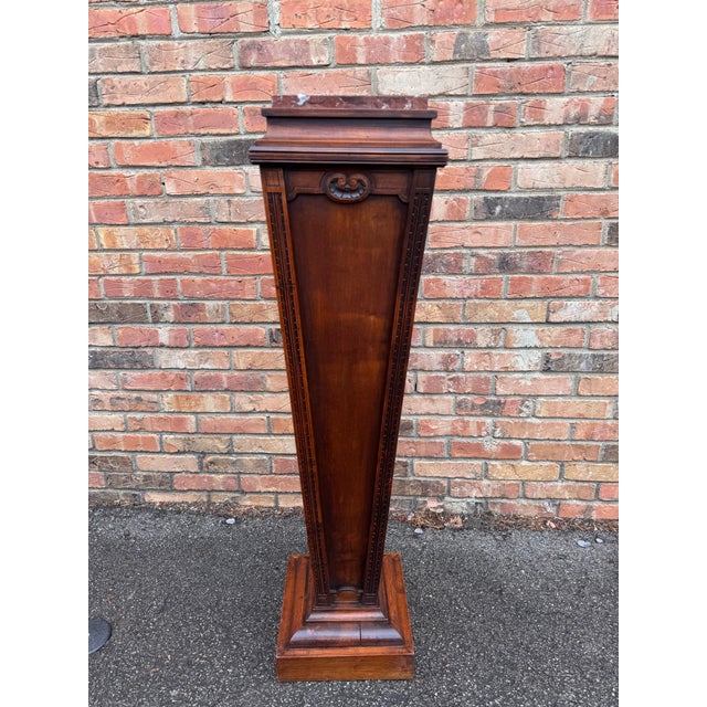 This is a Regency Mahogany and Marble Pedestal with applied panels on a shaped plinth with pedestal base. A versatile...
