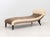 Embossed Leather and Flokati Wool Upholstered Chaise Longue, on four turned wood feet terminating in casters. 29" H x 72"...