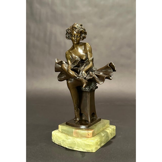 Period Art Deco bronze sculpture by Josef Lorenzo (1852-1950) of a beautiful ballerina seated with a pleasant gaze, in...