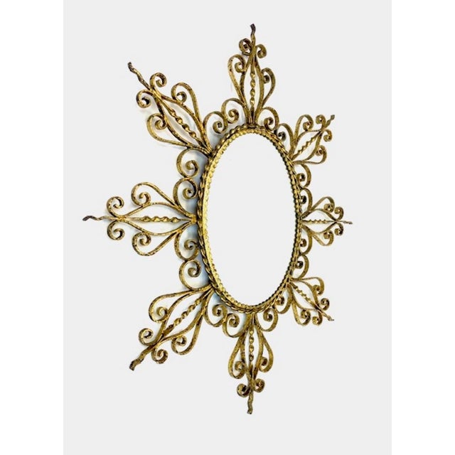 An elegant wall mirror with high-quality beveled glass set in a geometric mid-century wooden frame. Probably from Italy....
