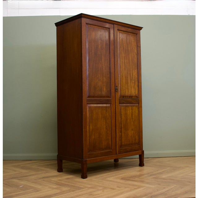 A Heal & Son double wardrobe dating to around 1920, beautifully made in richly figured mahogany. Featuring clean panelled...