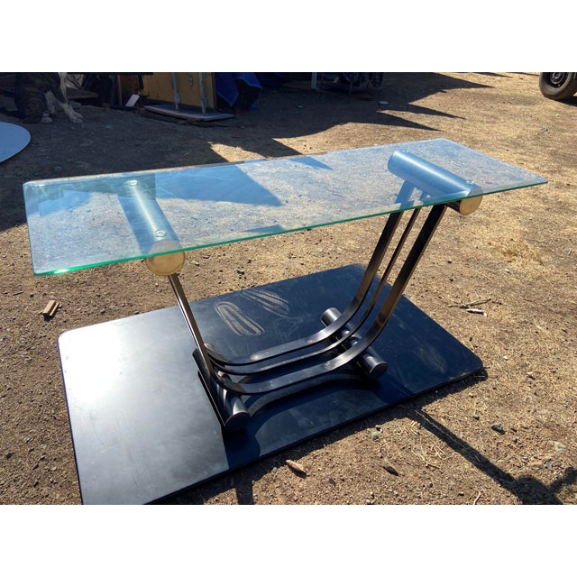 This Vintage Art Deco Romeo Rega Style Console Entry Table is a stunning piece of mid-century modern furniture. With a...