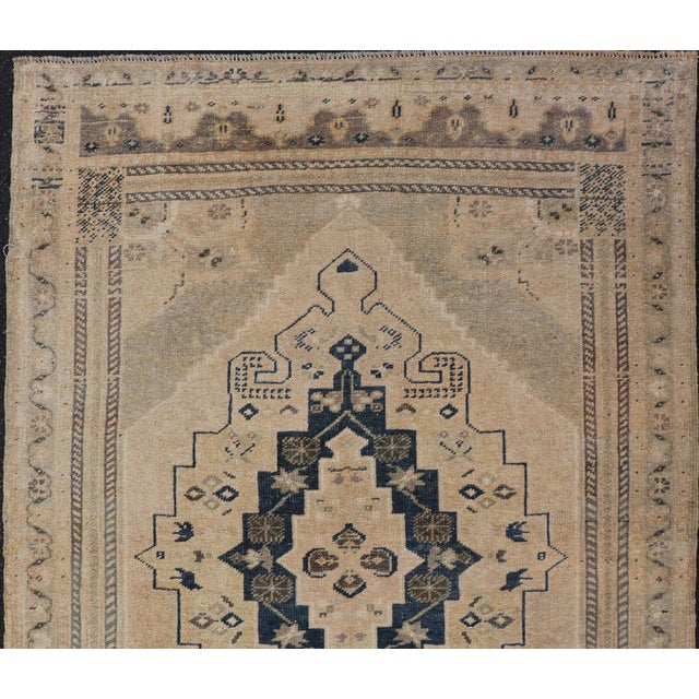 Measures: 3'5 x 5'2 This beautiful Vintage Turkish Oushak rug showcases a harmonious blend of warm beige tones and...