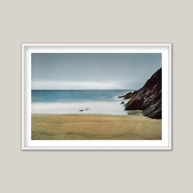 An early-morning photograph of Coumeenoole Strand, the remarkable beach on Ireland’s Dingle Peninsula. Made with a long...