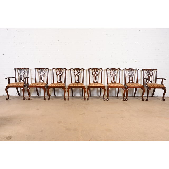 A gorgeous set of eight Chippendale or Georgian style dining chairs with ball and claw feet By Councill Furniture USA,...