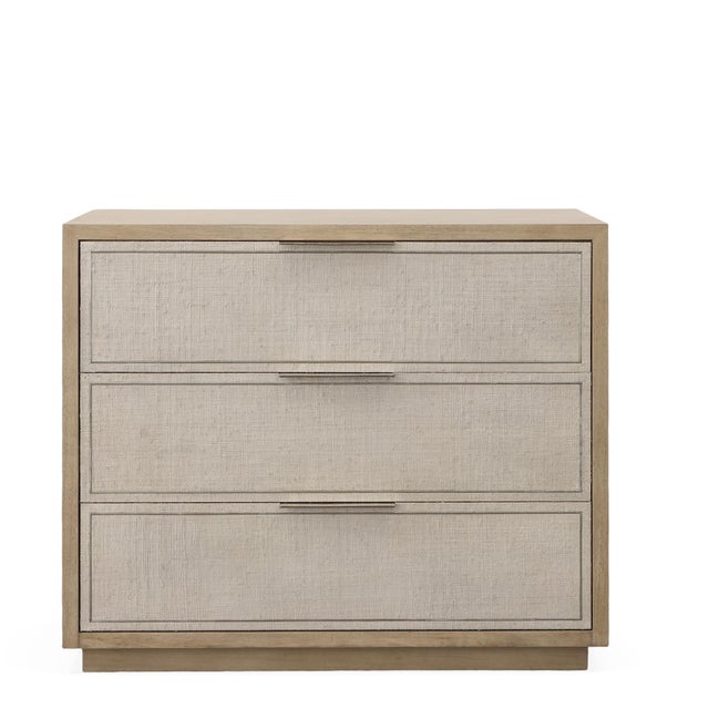 Three soft-close drawers with a tan/grey finish and grey textured linen panel fronts accented with polished nickel metal...