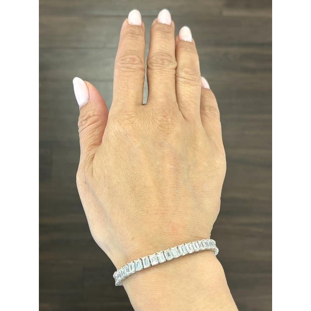 This magnificent bracelet is sure to turn heads. The bracelet boasts 48 diamonds that showcase a color of E/F and VS in...