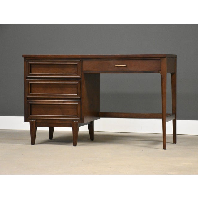 A mid century modern walnut desk with a single bank and semi finished back by Pepplers Fine Furniture. Made in Canada....