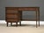 A mid century modern walnut desk with a single bank and semi finished back by Pepplers Fine Furniture. Made in Canada....