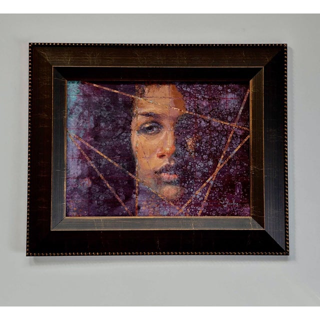 This artwork features a close-up portrait that captures a contemplative expression, with the subject's face partially...