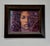 This artwork features a close-up portrait that captures a contemplative expression, with the subject's face partially...