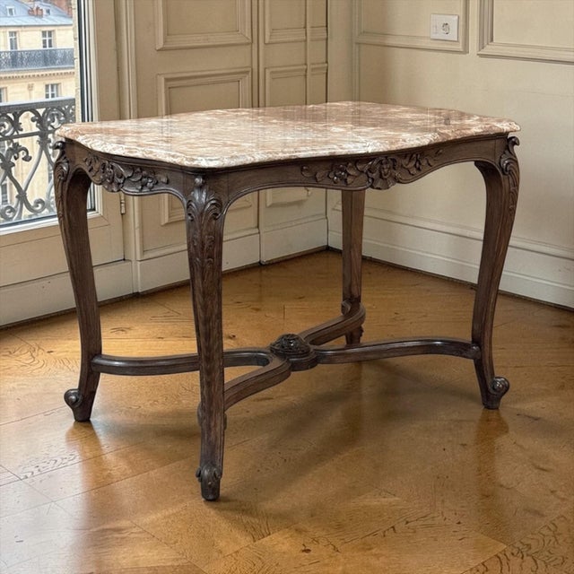 A fine late 19th century French Louis XV table, crafted in richly toned walnut and crowned with its original marble top....