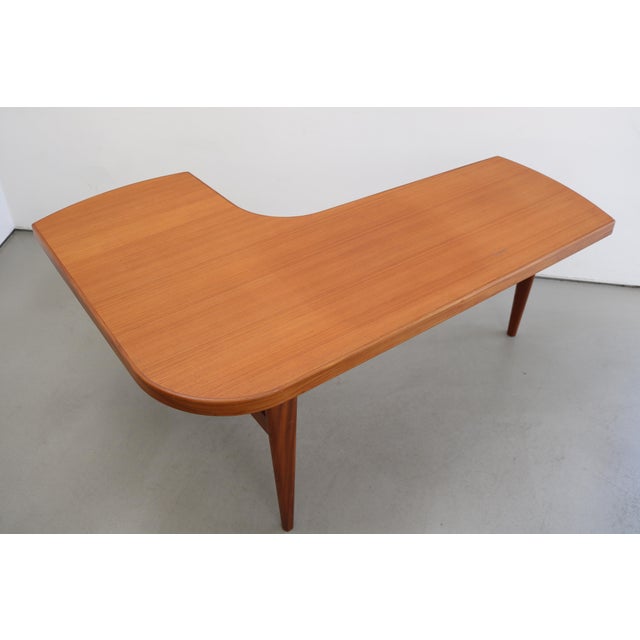 Boomerang Teak Coffee Table Made in Denmark, 1960s Very rare model Length 130cm, Depth 90cm, Height 55cm Can also be used...