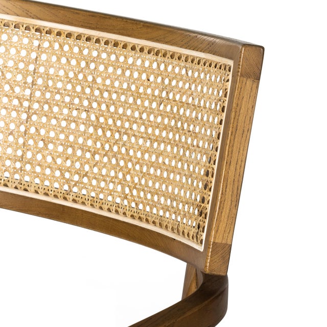 Mixed materials refresh retro dining style. Solid nettlewood frames a textural inlay of natural cane, with Velcro-fastened...